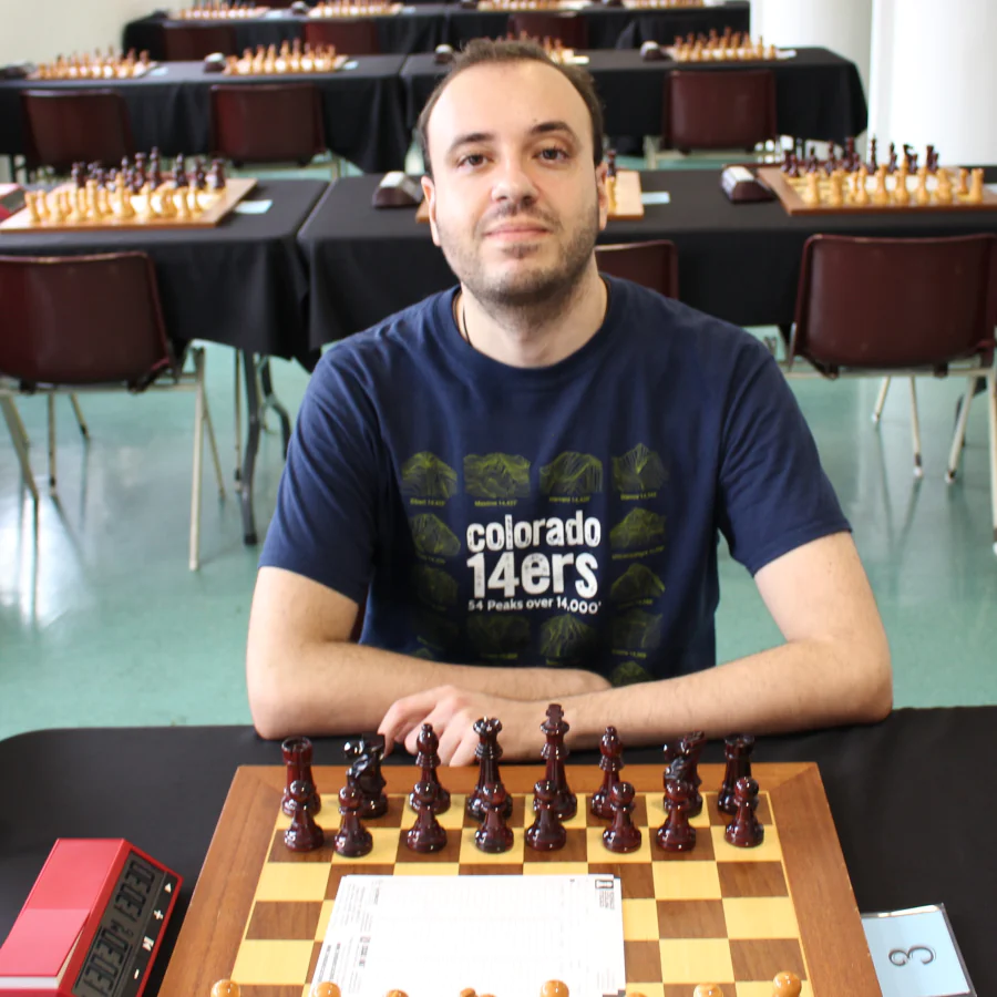 Alessio sitting at a chess board